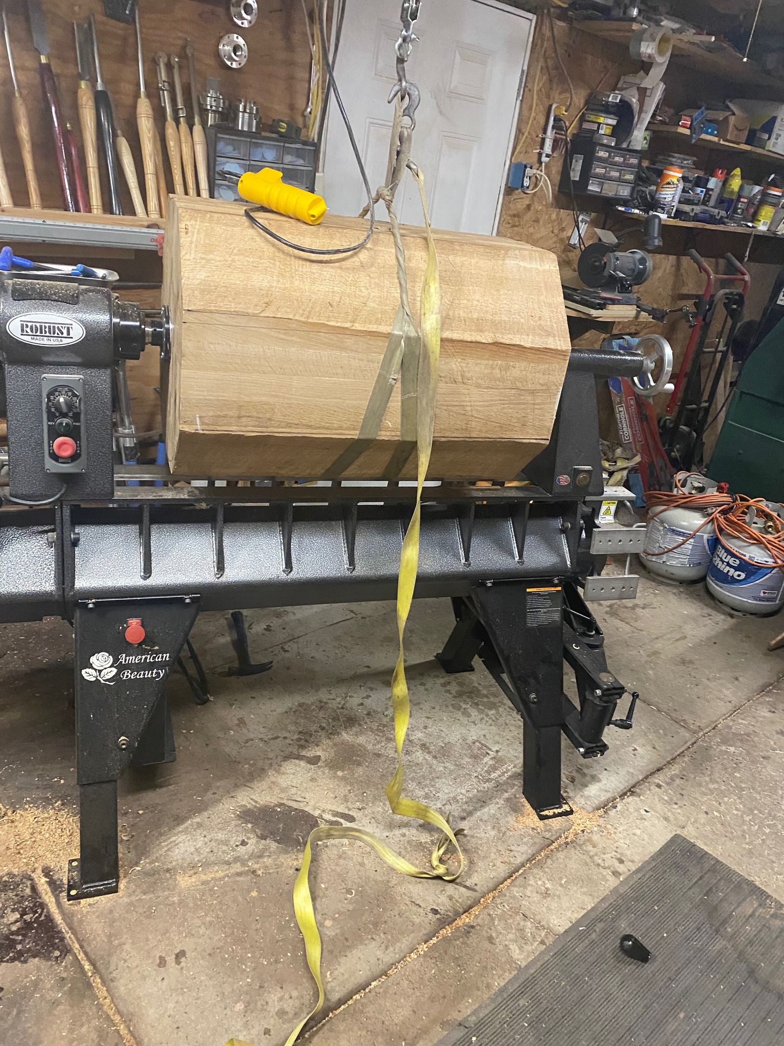 Raw burl on the lathe, strapped and ready to turn.