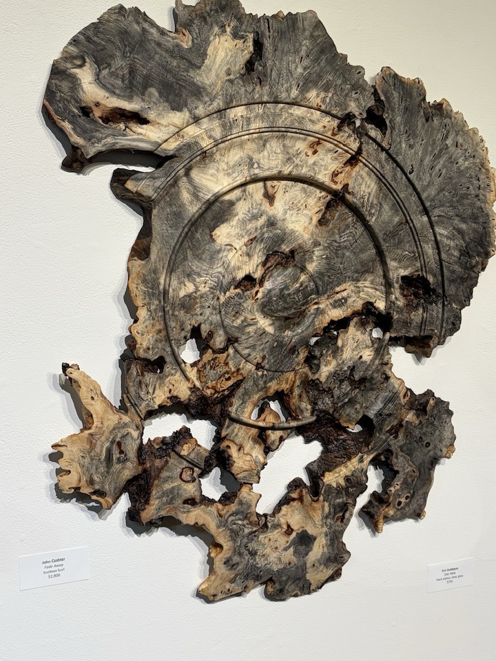 Live-edge wall relief in figured wood.